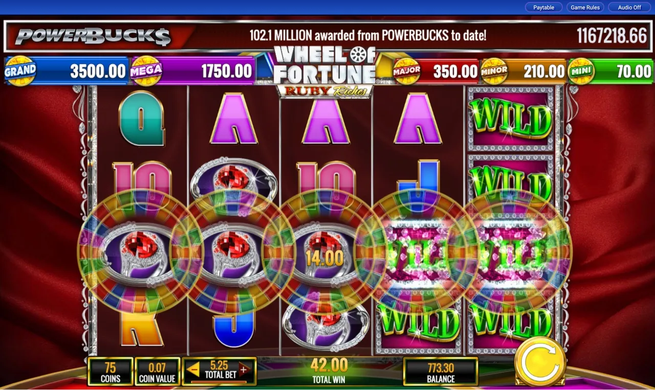 Total Win 42.00 from coin-wheel plus full WILD reel
